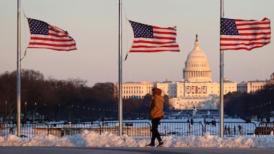 Flags fly at half-mast near the US Capitol building during preparations for president-elect Donald Trump's inauguration. Reuters