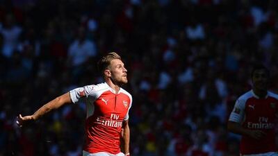 Arsenal’s Welsh midfielder Aaron Ramsey prepares to gather the ball during the FA Community Shield football match between Arsenal and Chelsea at Wembley Stadium in north London on August 2, 2015. Arsenal won the game 1-0. AFP PHOTO / GLYN KIRK