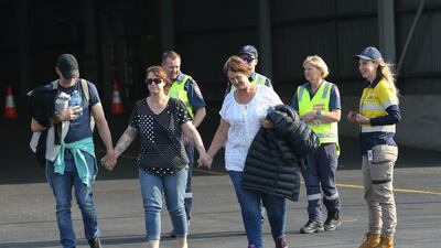 Evacuees from Mallacoota arrive aboard the navy ship MV Sycamore at the port of Hastings, Australia. Getty