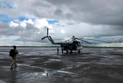 A UN humanitarian helicopter prepares to set off from Beira, Mozambique, to find cyclone survivors on March 22, 2019. AP Photo