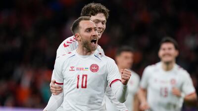 Denmark's Christian Eriksen celebrates scoring his side's second goal during the international friendly soccer match between the Netherlands and Denmark at the Johan Cruyff ArenA in Amsterdam, Netherlands, Saturday, March 26, 2022. The match was Eriksen's first appearance for Denmark since he collapsed after suffering a cardiac arrest during a European Championship game in June. The Netherlands-Denmark friendly was being played at Amsterdam's Johan Cruyff Arena, where Eriksen made his name as a playmaker for Dutch club Ajax. (AP Photo / Peter Dejong)