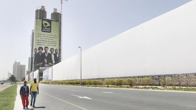 Billboard signs at Al Sufouh 1, in front of Sky Spiral Towers. Reem Mohammed / The National