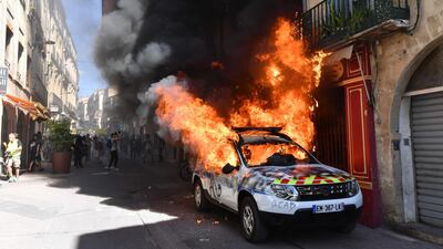 A French Municipal Police car is set on fire on the sidelines of an anti-government demonstration called by the "Yellow Vests" (Gilets Jaunes) movement in Montpellier, southern France. AFP / Pascal GUYOT