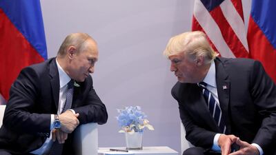 Russia's President Vladimir Putin talking to US President Donald Trump at the G20 summit in Hamburg, Germany, last year. Carlos Barria / Reuters