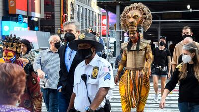 Costumed cast members of Broadway's 'The Lion King' appear in Times Square to herald the return of Broadway theatre in New York City. AP