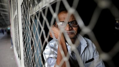 An Indian elderly commuter sits rides on a local train in the eastern Indian city of Kolkata, Eastern India. EPA