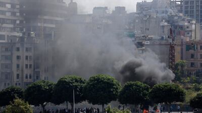 Black smoke rise from burning tires that were set fire to block a road during a protest against government's plans to impose new taxes in Beirut, Lebanon, Saturday, October 19, 2019. AP