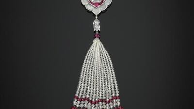 A pendant brooch set with diamonds and rubies. Prudence Cuming Associates