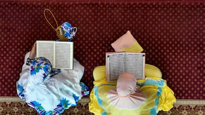 Indonesians read the Quran at the Al Makmur mosque in Banda Aceh. AFP