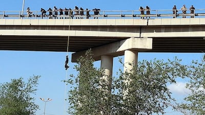 ISIL militants abseil from a bridge during their military training in Mosul on November 2. Dozens of Islamic state fighters performed a military training in central Mosul under tight security measures. EPA