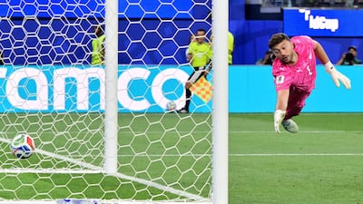 New Zealand's goalkeeper Max Crocombe is unable to stop Iran's second goal, scored by midfielder Mohammad Mohebbi. AFP