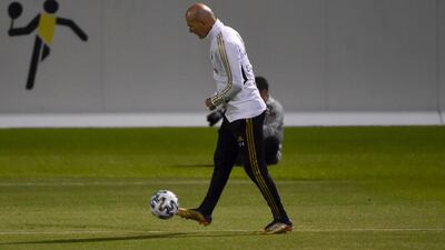 Zinedine Zidane kicks a ball during Real Madrid's training session. AFP