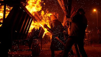 Swiss light bundles of pinewood chips during the “Chienbase” procession in Liestal, northern Switzerland. Michael Buholzer / AFP Photo