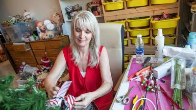 Janet Waite makes Christmas decorations. People are reportedly putting their Christmas trees up early to brighten a dreary year. Antonie Robertson / The National