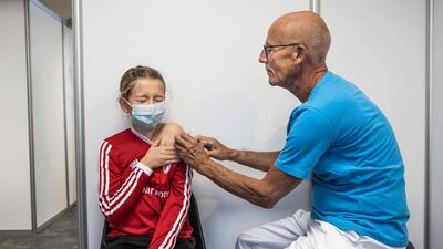 A young girl receives Covid-19 vaccination in Amagar, Denmark. AFP