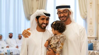 Sheikh Mohamed bin Zayed meets family members who received the Amnetak Beladak souvenir, during a Sea Palace barza. Mohamed Al Hammadi / Ministry of Presidential Affairs