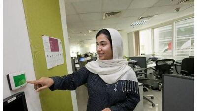 Farhana Imran of Archcorp shows a thermostat in her company's office. By mandating a temperature a little higher than the setting in most offices, the architectural engineering firm has cut its electricity bill. Jaime Puebla / The National