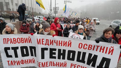 Ukrainians take part in a protest against Covid-19 restrictions for unvaccinated people in Kiev. EPA