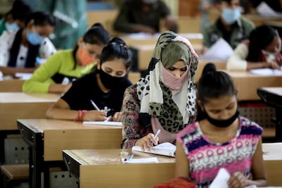 Indian school children sit exams in Bhopal in September. EPA