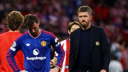 Manchester United manager Michael Carrick and Mason Mount look dejected after the match. Reuters