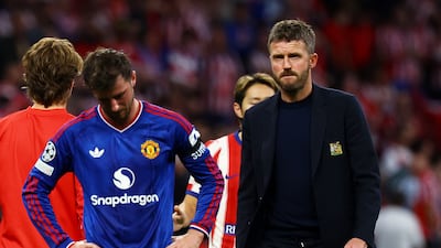 Manchester United manager Michael Carrick and Mason Mount look dejected after the match. Reuters