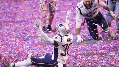 Patriots linebacker Brandon King sits in confetti as he celebrates. USA Today Sports