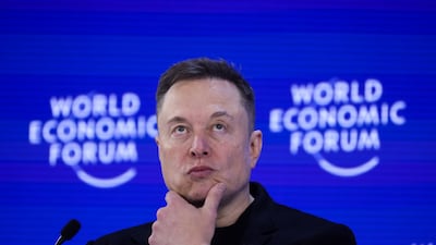 Elon Musk on stage at Davos. Bloomberg