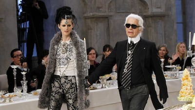 Karl Lagerfeld and Stella Tennant walk the runway for the finale of the Chanel Metiers d'Art Pre-Fall show, December 2016. AFP