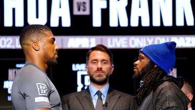 Boxing promoter Eddie Hearn stands between Anthony Joshua, left, and Jermaine Franklin as they face off during a press conference at the Nobu Hotel, in London on March 29, 2023. PA