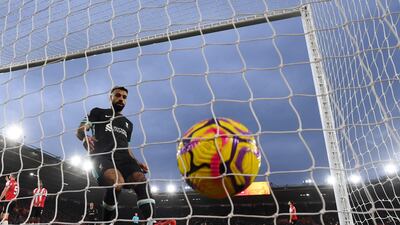 Mohamed Salah goes to collect the ball after making it 2-2 at St Mary's Stadium. AFP