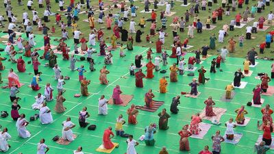 Indian people take part in a mass yoga session to mark the International Yoga Day at Umaid stadium in Jodhpur. AFP