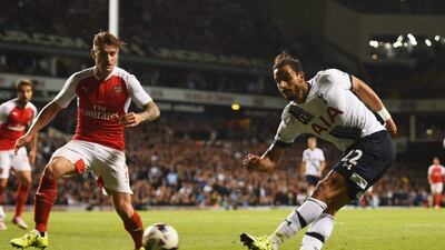 Nacer Chadli of Spurs shoots and gets a deflection off Calum Chambers, unseen, for an own goal equaliser on Wednesday night during their League Cup match at White Hart Lane. Tom Dulat / Getty images