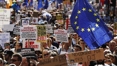 Demonstrators wave EU flags and hold placards outside Downing Street during a protest against the proroguing of parliament in London. Bloomberg