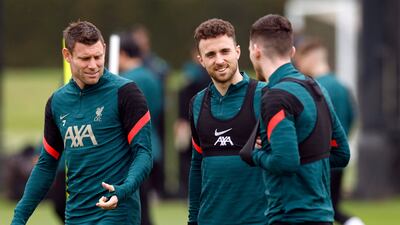 James Milner and Diogo Jota train on Monday. Reuters