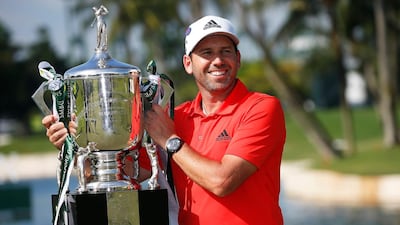 Sergio Garcia of Spain poses with his trophy on the Serapong Course after winning the Singapore Open on Sentosa Island. Wallace Woon / EPA