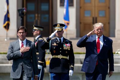 US President Donald Trump and new US Secretary of Defence Mark Esper, left, participate in a full honours welcome ceremony at the Pentagon in Arlington, Virginia. EPA