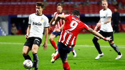 Atletico Madrid's Luis Suarez scores their second goal. Reuters