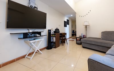 The living room is clean and simple. Chris Whiteoak / The National