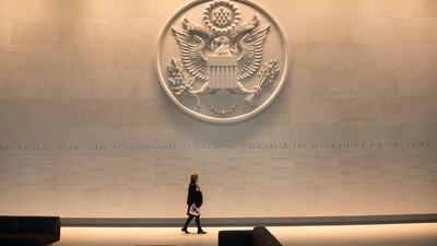 A person walks inside prior to the unveiling of the new US Embassy building in London. Stefan Rousseau - WPA Pool / Getty Images