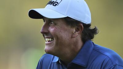 Phil Mickelson smiles after chipping it in for an eagle on the third hole during a practice round ahead of the Masters golf tournament on April 4, 2017, in Augusta, Georgia. Curtis Compton / AP