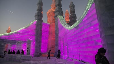 Chinese labourers work to finish large ice sculptures in preparation for the Harbin Ice and Snow Festival in Harbin. Getty Images