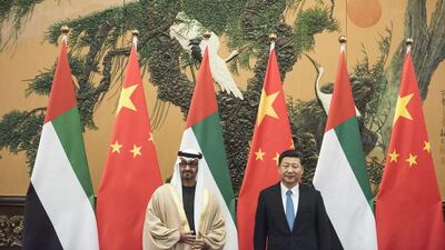 Sheikh Mohammed bin Zayed, Crown Prince of Abu Dhabi and Deputy Supreme Commander of the Armed Forces, poses with Chinese President Xi Jinping during their meeting at the Great Hall of the People in Beijing, China. Fred Dufour / EPA / Pool Pool