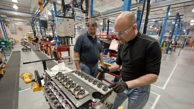 David Booth builds a Chevrolet Corvette LS9 engine with the assistance of a General Motors engine builder, Bruce Blomfield, at the GM Performance Build Center in Wixom, Michigan. Steve Fecht / General Motors