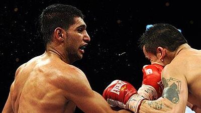 Amir Khan lands with a vicious right hand during his unanimous points win over Marcos Maidana.
