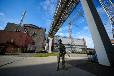 A Russian soldier guards the Zaporizhzhia nuclear power station in south-eastern Ukraine. AP
