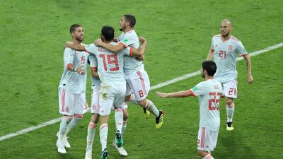 Spain celebrate Diego Costa scoring his second goal, leveling the score once again at 2-2. Lucy Nicholson / Reuters