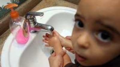 Moatasem, aged three, is taught how to wash his hands at a Dubai nursery school.