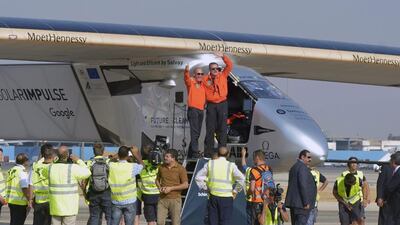Andre Borschberg is welcomed by Bertrand Piccard after landing in Cairo. Khaled Desouki / AFP