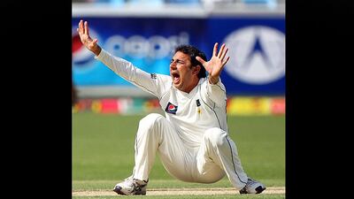 Saeed Ajmal of Pakistan appeals successfully for the dismissal of England player Eoin Morgan during the first Test match between Pakistan and England at the Dubai International Cricket Stadium. Satish Kumar / The National