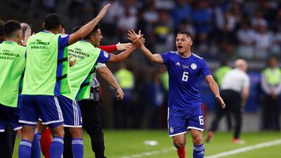Paraguay's Richard Sanchez, right, celebrates after scoring against Argentina. Reuters